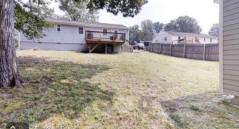 3300 Sylvania Road Chester, VA 23831 - Photo 14 of 16 a view of a backyard with a large tree and wooden fence