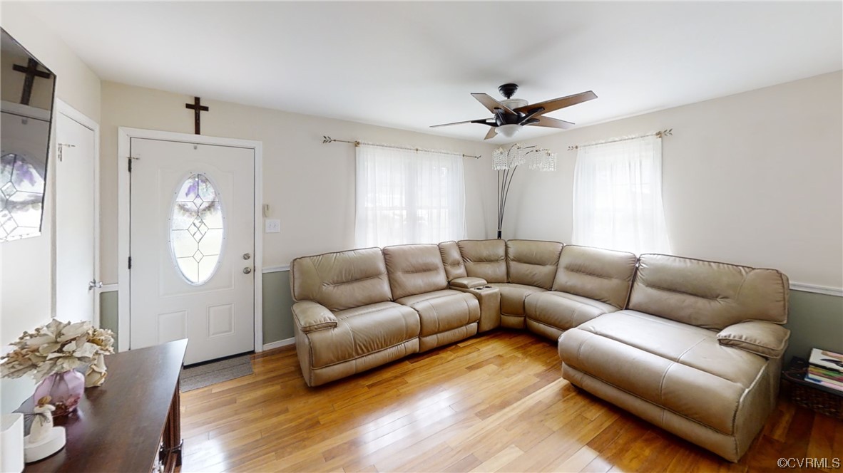 3300 Sylvania Road Chester, VA 23831 - Photo 2 of 16 a living room with furniture a ceiling fan a window and a window