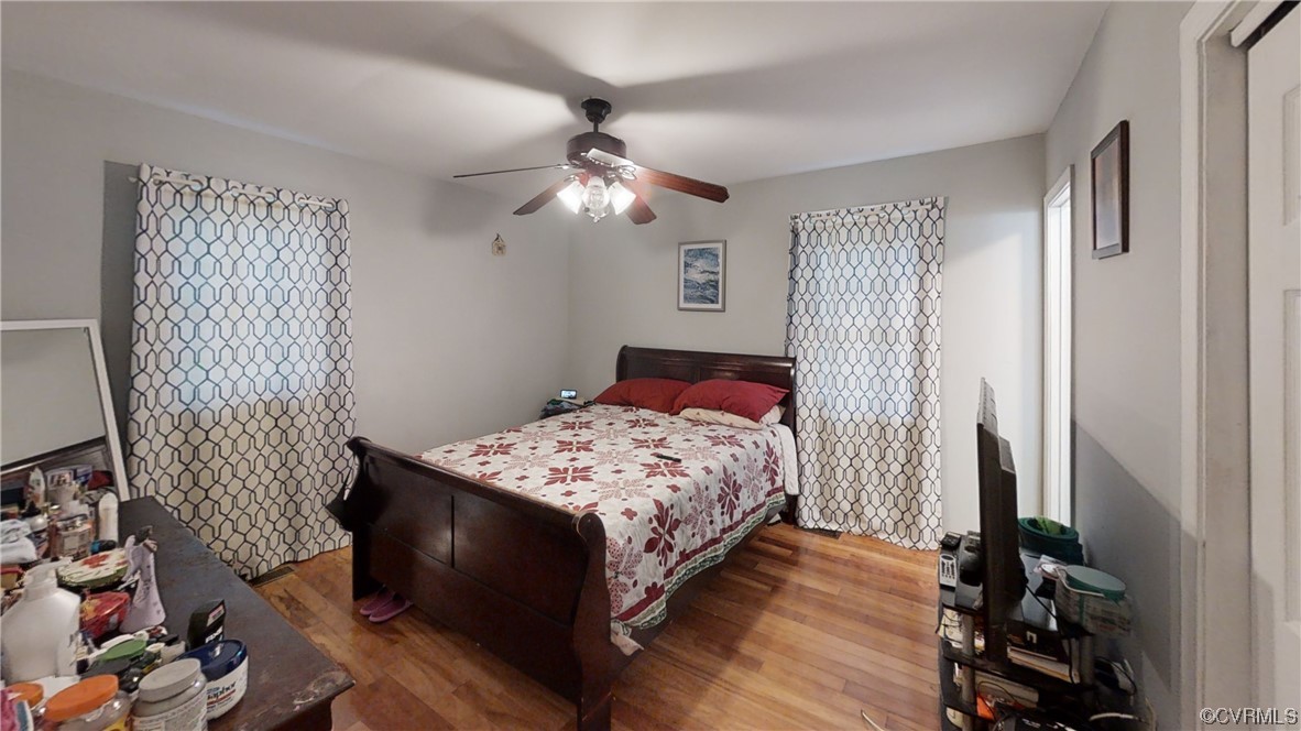 3300 Sylvania Road Chester, VA 23831 - Photo 5 of 16 a bedroom with a bed and a chandelier