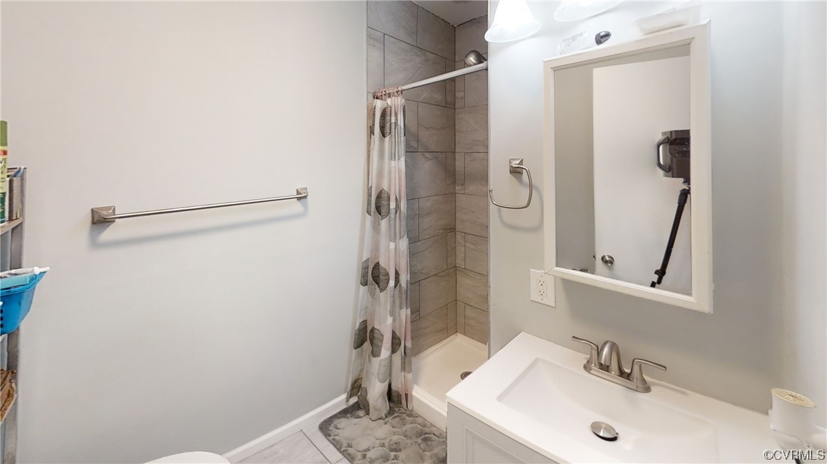 3300 Sylvania Road Chester, VA 23831 - Photo 7 of 16 a bathroom with a sink and a mirror