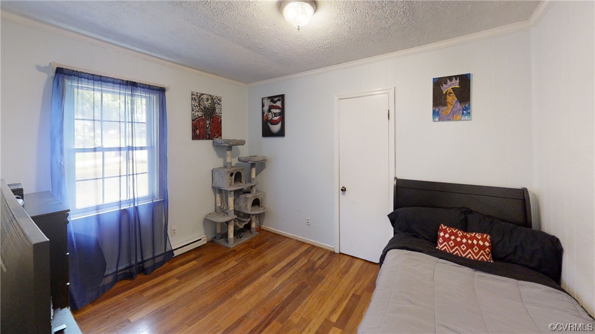 3300 Sylvania Road Chester, VA 23831 - Photo 8 of 16 a bedroom with furniture and a window