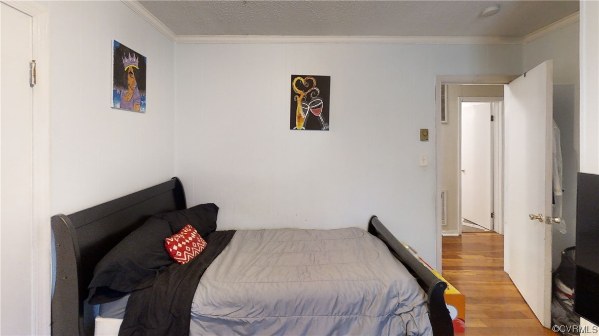 3300 Sylvania Road Chester, VA 23831 - Photo 9 of 16 a bedroom with a bed and a chair