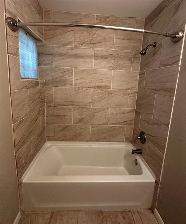 400 East Liberty Street Pilot Point, TX 76258 - Photo 16 of 16 Full bathroom with tub / shower combination and baseboards