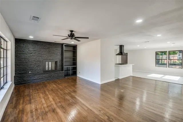 a view of a kitchen with a sink and a refrigerator
