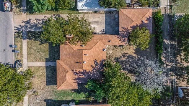 front view of a house with a tree