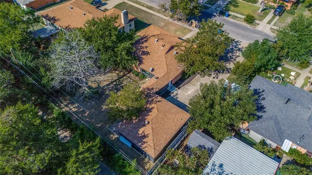an aerial view of a house with outdoor space