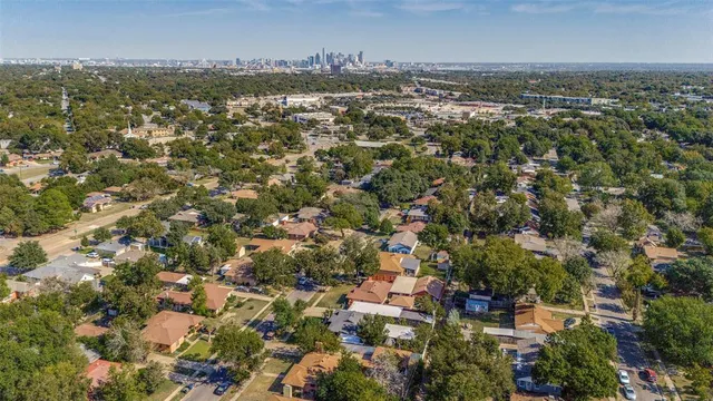 an aerial view of multiple house with yard