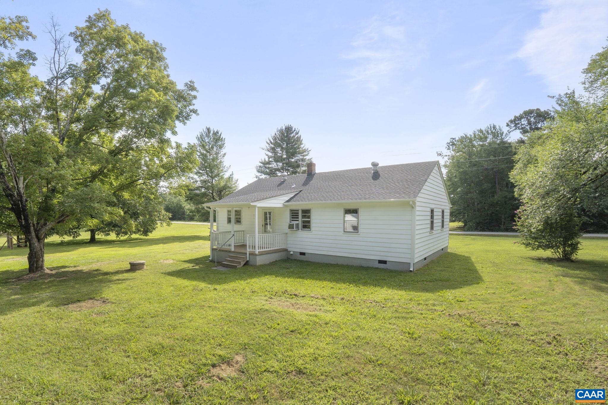 12395 South Constitution Route Scottsville, VA 24590 - Photo 27 of 37 a view of a house with a big yard and large tree