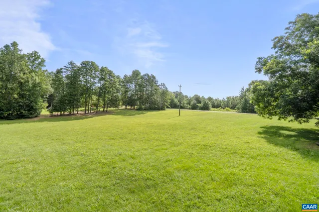a view of a field with an ocean