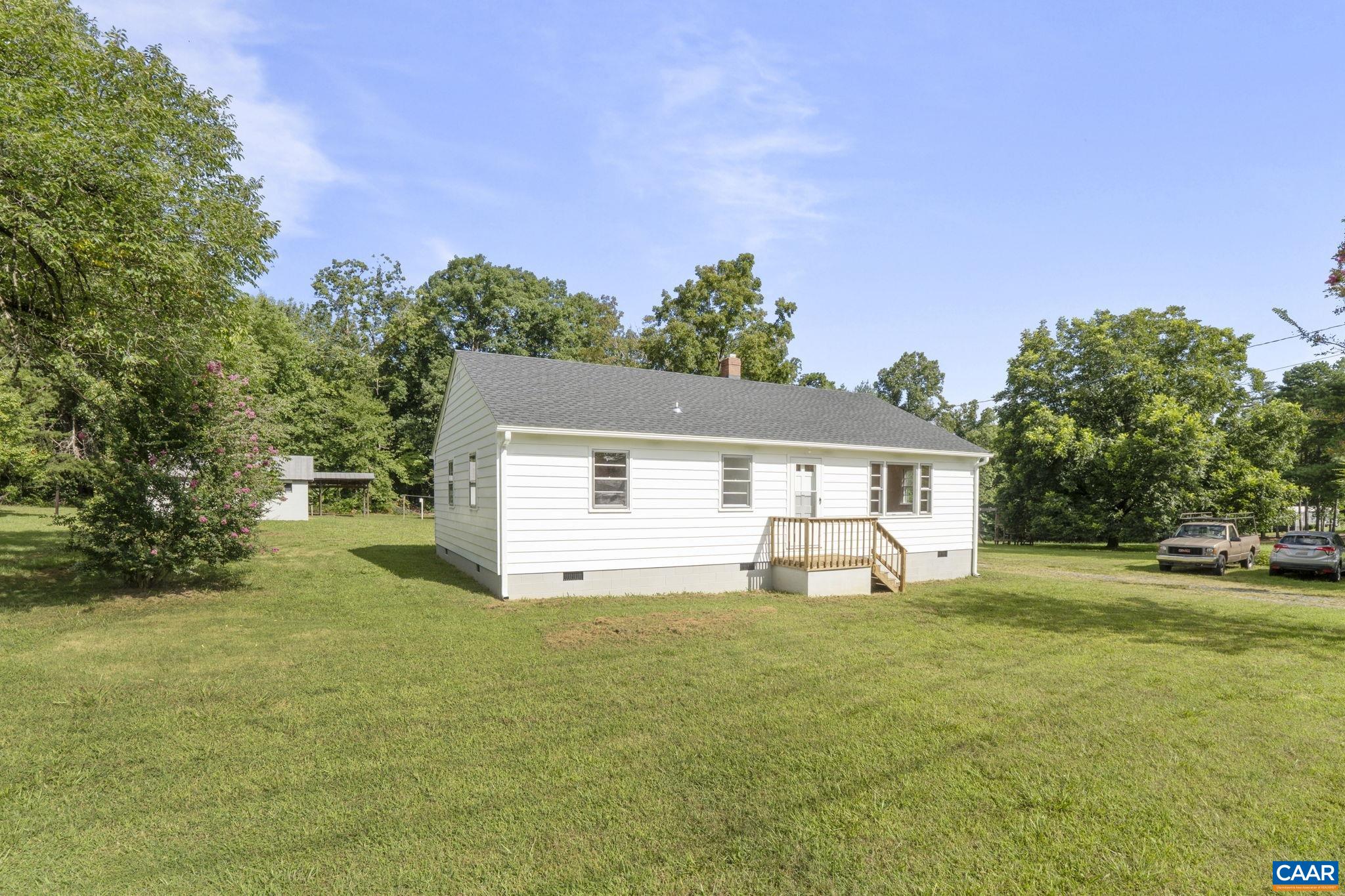 12395 South Constitution Route Scottsville, VA 24590 - Photo 33 of 37 a view of a house with a yard and garage