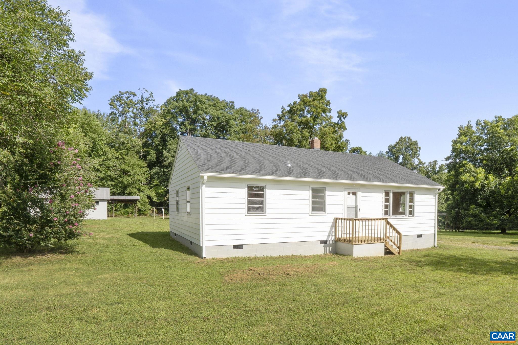12395 South Constitution Route Scottsville, VA 24590 - Photo 34 of 37 front view of a house with a yard