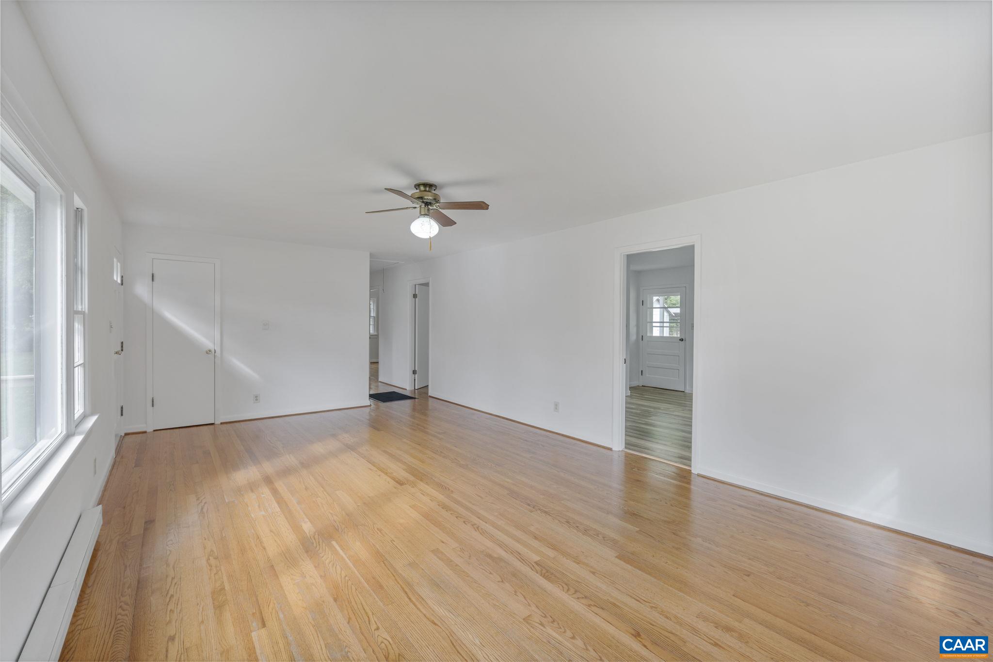 12395 South Constitution Route Scottsville, VA 24590 - Photo 4 of 37 a view of an empty room with wooden floor