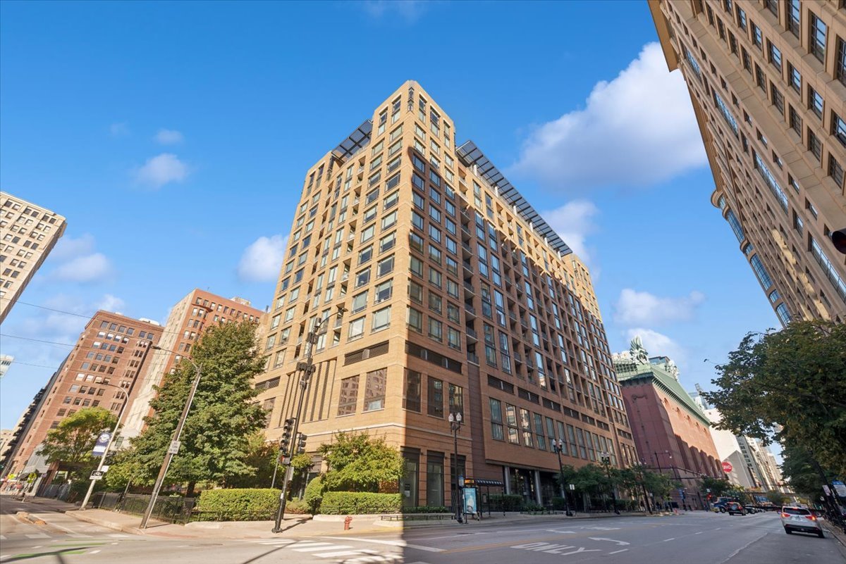 520 South State Street, Unit 907 Chicago, IL 60605 - Photo 1 of 26 a view of a tall building next to a road