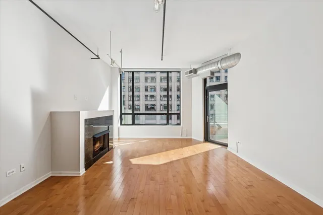 a view of livingroom with hardwood floor and a ceiling fan