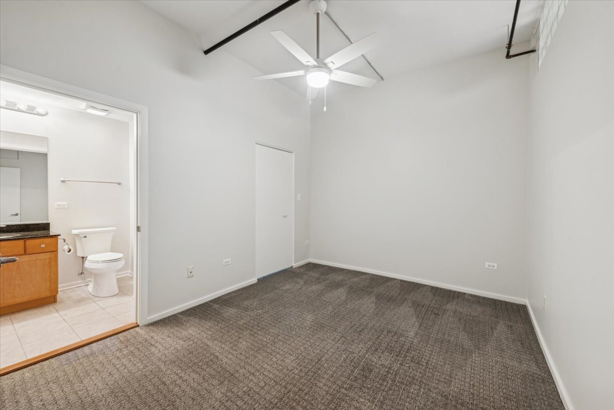 520 South State Street, Unit 907 Chicago, IL 60605 - Photo 19 of 26 an empty room with a bathroom and a sink