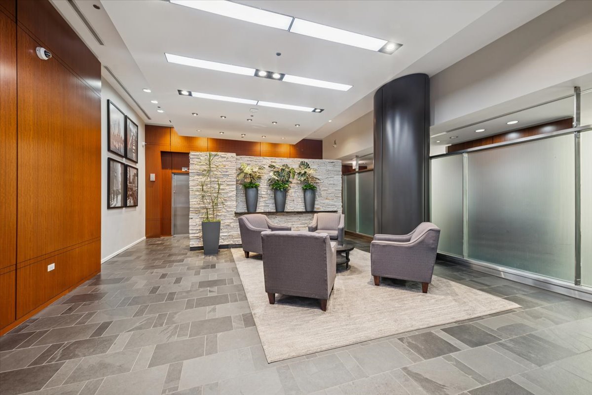 520 South State Street, Unit 907 Chicago, IL 60605 - Photo 2 of 26 a living room with furniture and a large window