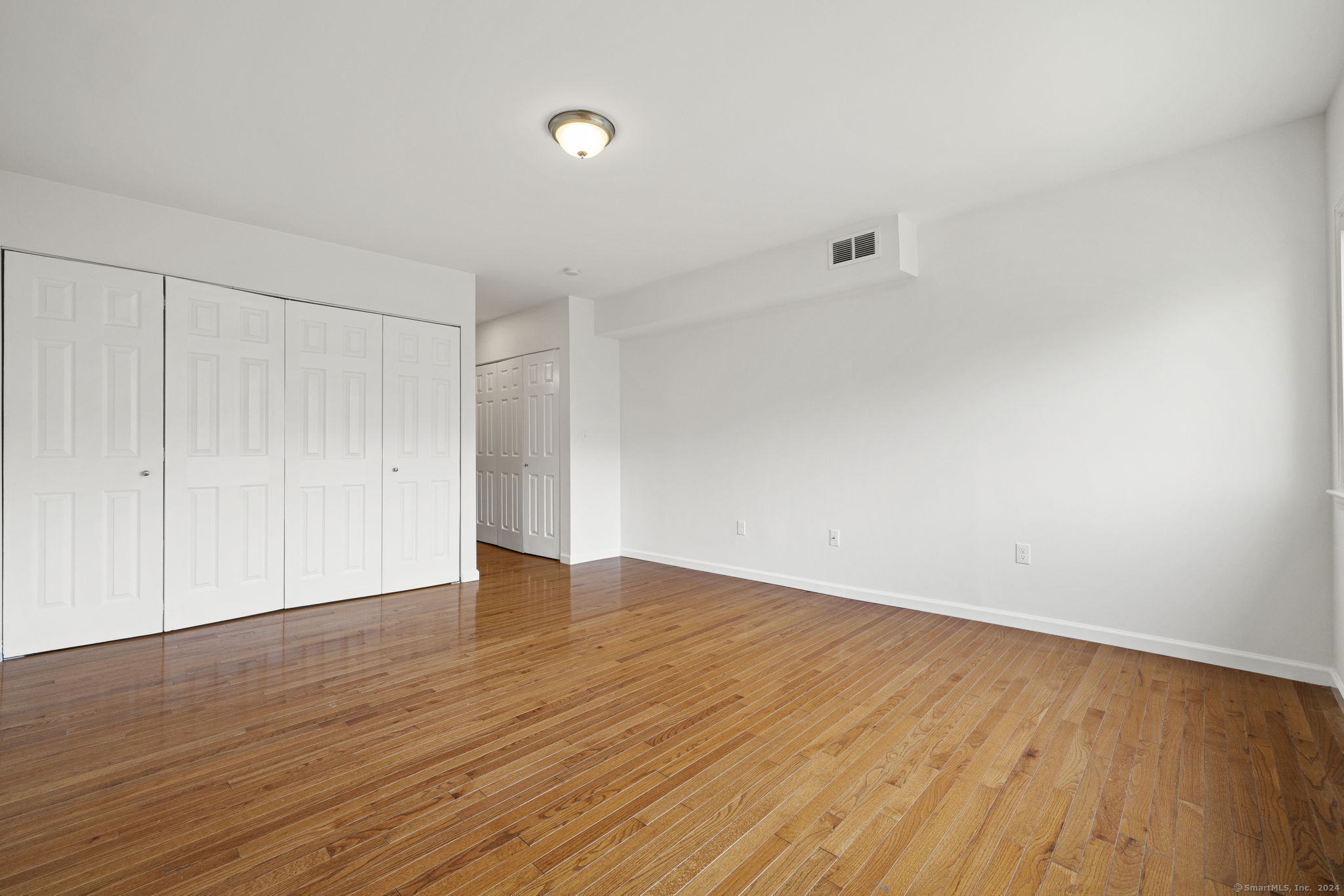 1153 Stratfield Road, Unit 1153 Fairfield, CT 06825 - Photo 5 of 18 Large primary bedroom with tons of closet space