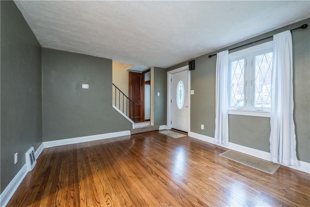 227 East Garden Road Pittsburgh, PA 15227 - Photo 2 of 27 Tons of natural light streams in through the large picture window in the living room.
