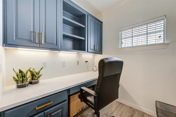 a view of cabinets and chair in a room