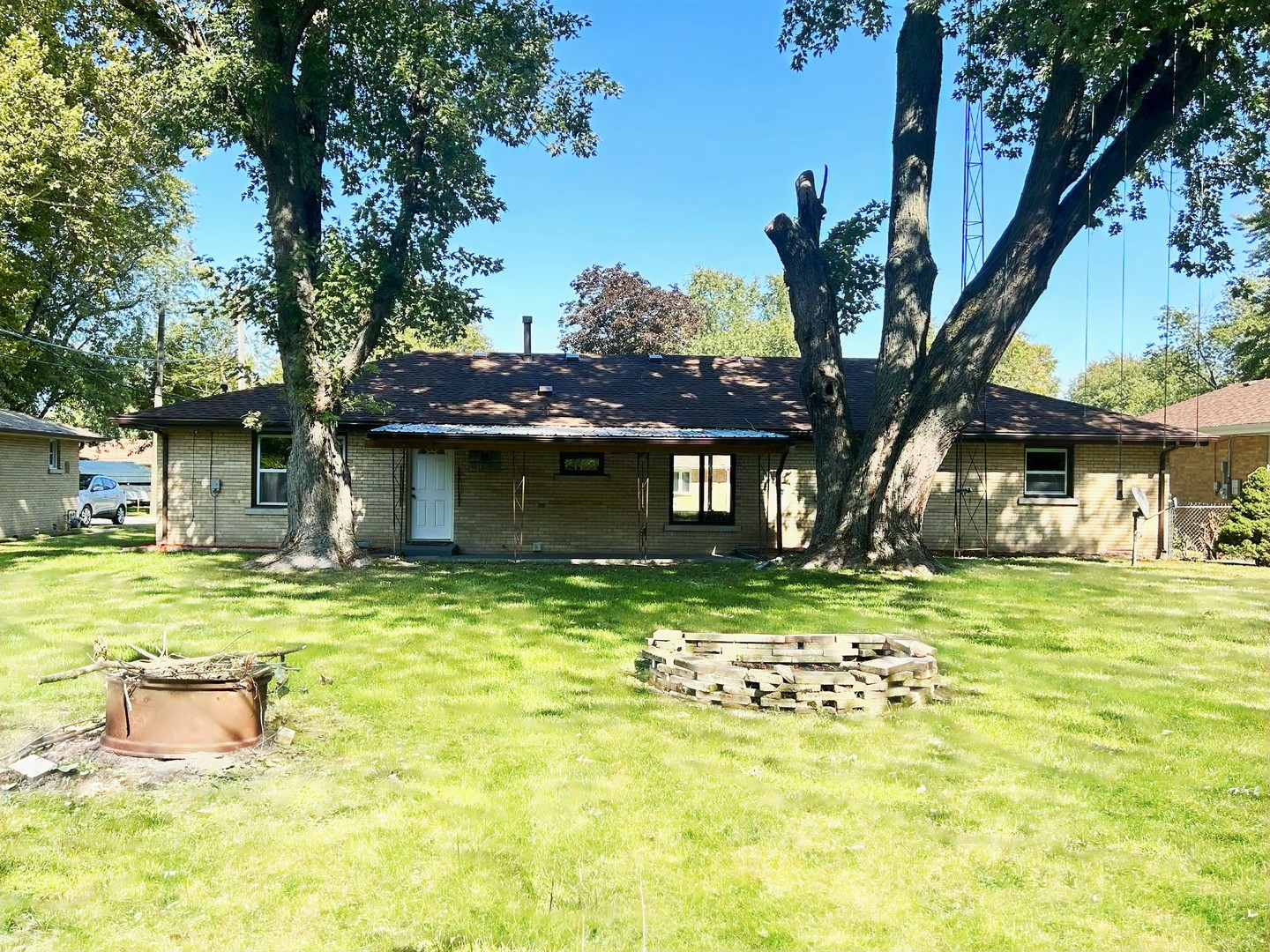 55 Cherry Drive Kankakee, IL 60901 - Photo 30 of 42 a front view of a house with a garden