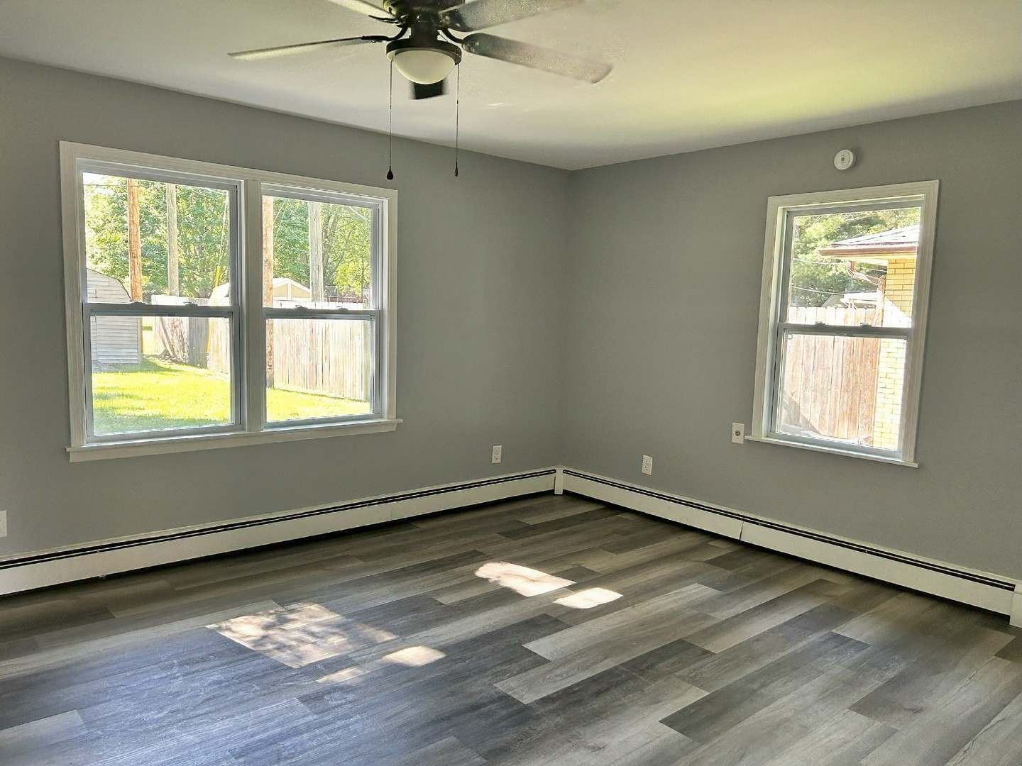55 Cherry Drive Kankakee, IL 60901 - Photo 38 of 42 a view of an empty room with wooden floor and a window