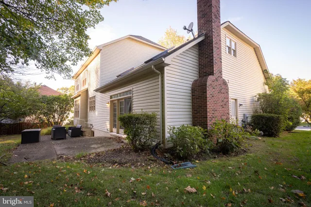 a house view with a sitting space and garden