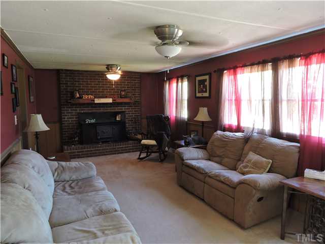 4892 Boston Road Roxboro, NC 27574 - Photo 3 of 11 a living room with furniture and a fireplace