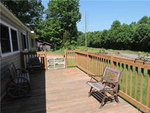 4892 Boston Road Roxboro, NC 27574 - Photo 8 of 11 a view of a chair and tables on the roof deck