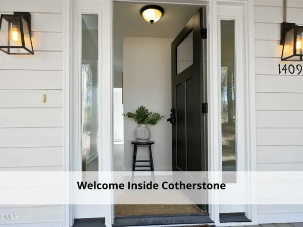 a view of a room with a table and chairs