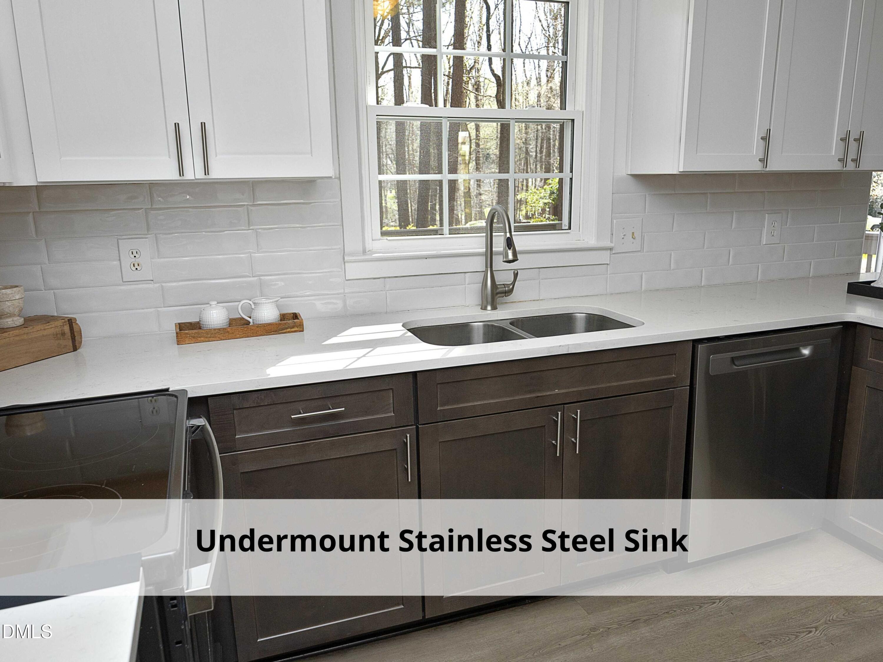1409 Cotherstone Drive Durham, NC 27712 - Photo 26 of 61 a kitchen with a sink and cabinets