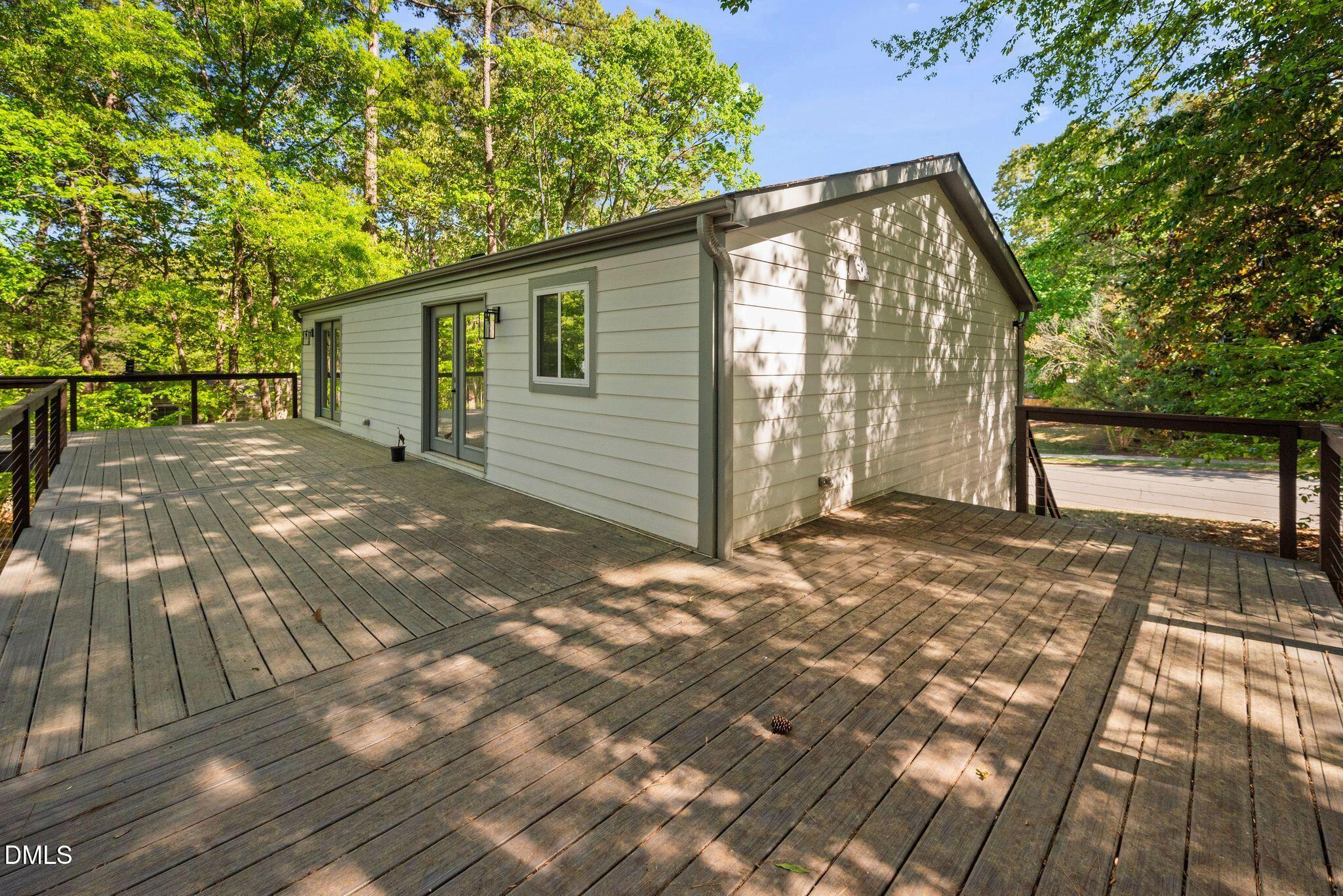 313 Crown Oaks Drive Raleigh, NC 27615 - Photo 36 of 60 a backyard of a house with barbeque oven