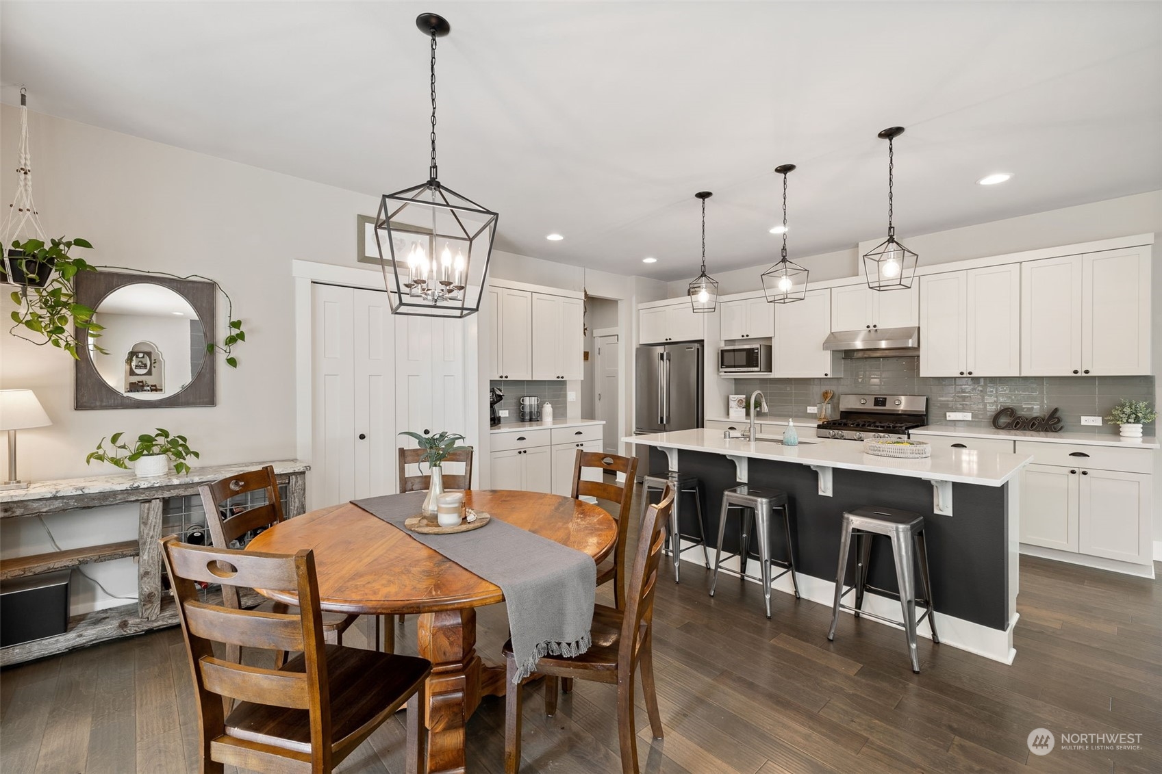 18 213th Street Southwest Bothell, WA 98021 - Photo 12 of 40 a large kitchen with a table and chairs