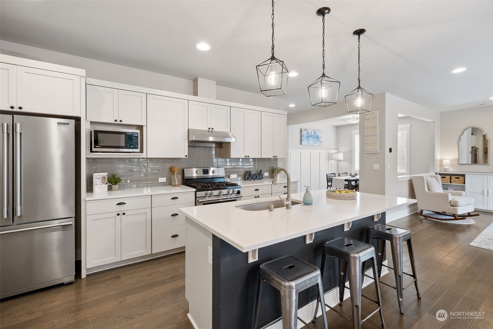 18 213th Street Southwest Bothell, WA 98021 - Photo 14 of 40 a kitchen with kitchen island appliances a sink and cabinets