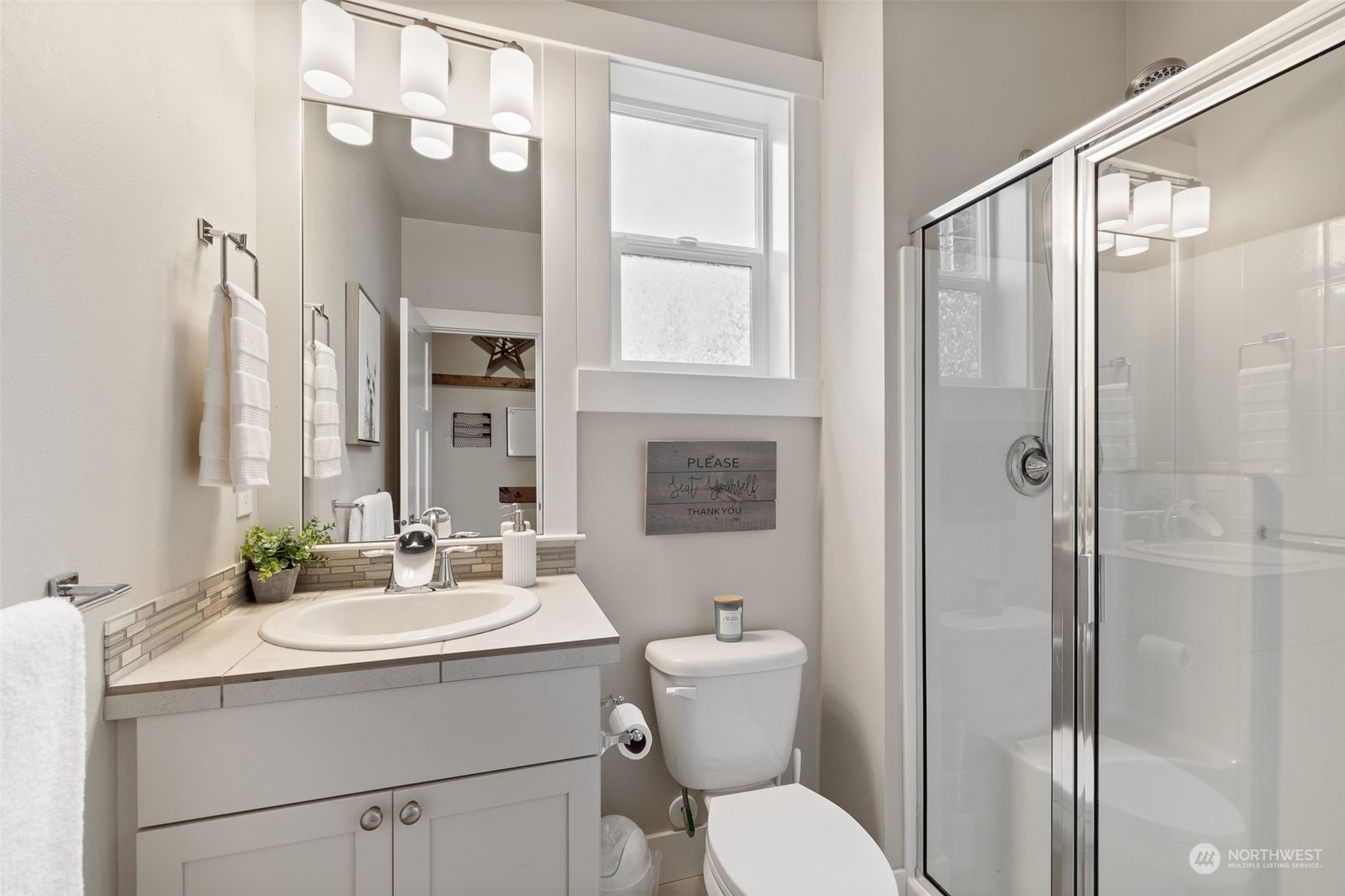 18 213th Street Southwest Bothell, WA 98021 - Photo 18 of 40 a bathroom with a sink toilet and shower