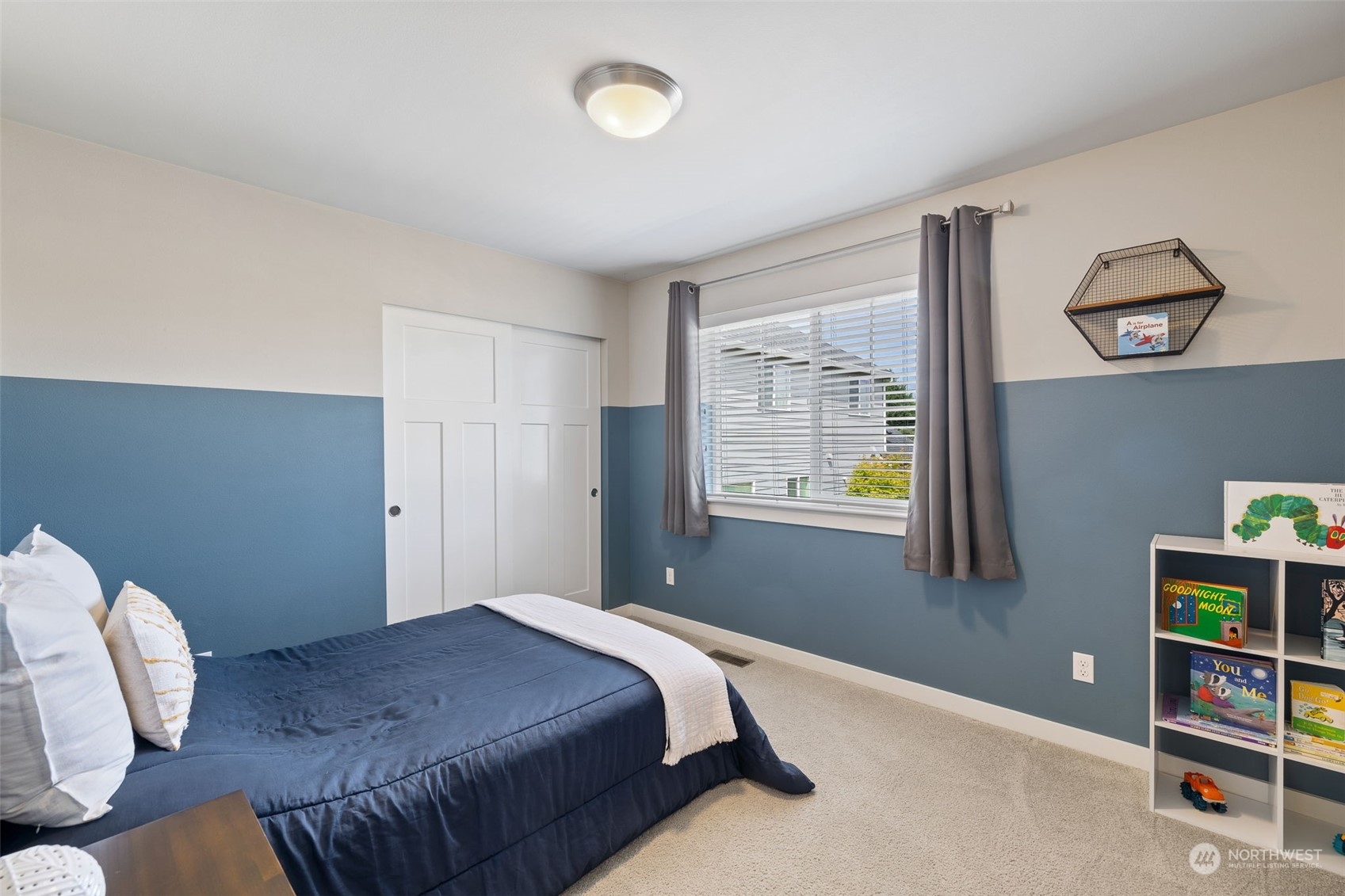 18 213th Street Southwest Bothell, WA 98021 - Photo 30 of 40 a bedroom with a bed and a window