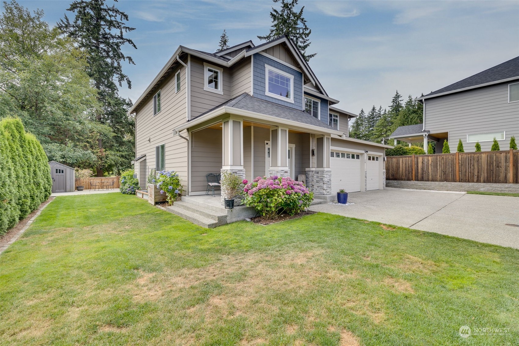 18 213th Street Southwest Bothell, WA 98021 - Photo 3 of 40 a front view of a house with garden