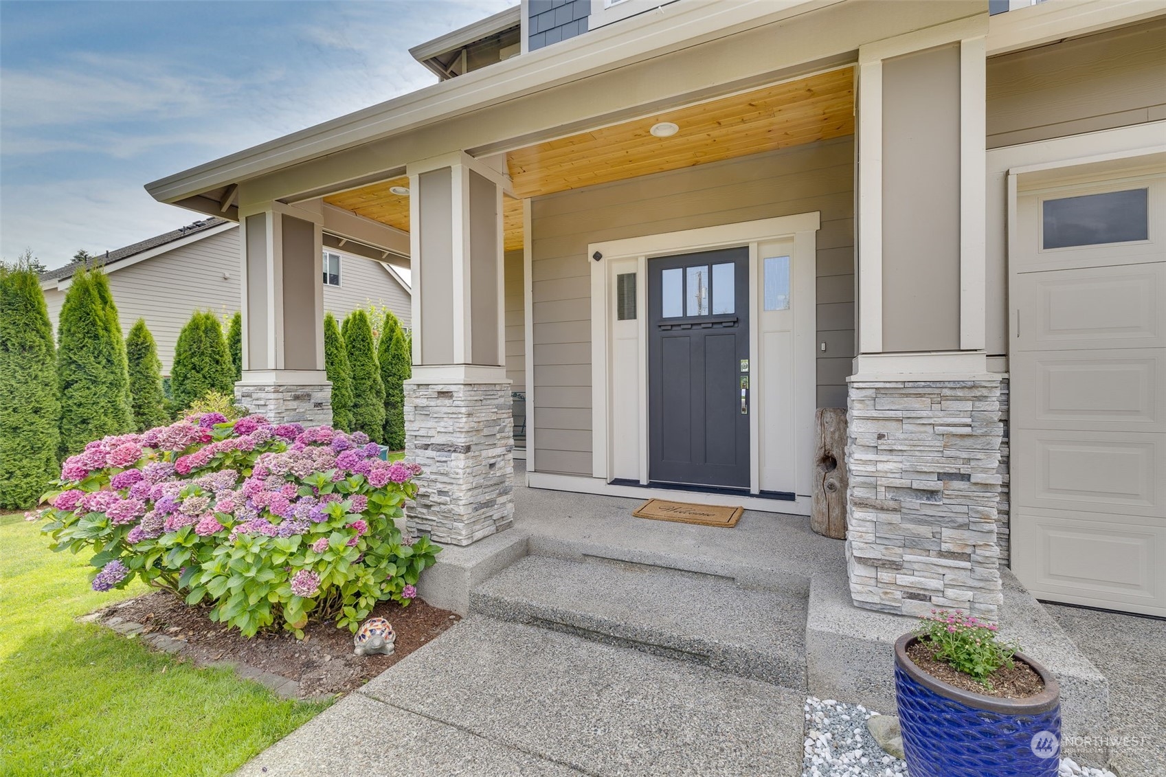 18 213th Street Southwest Bothell, WA 98021 - Photo 4 of 40 a front view of a house with garden