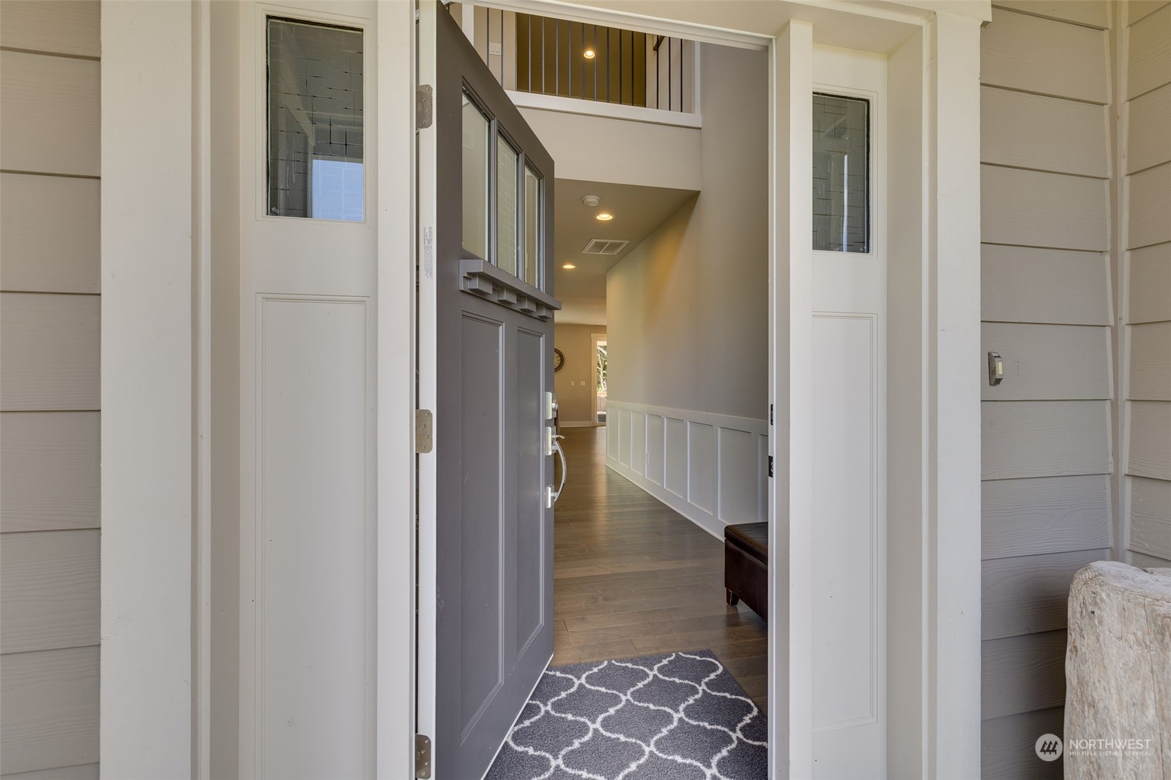 18 213th Street Southwest Bothell, WA 98021 - Photo 5 of 40 a view of a hallway with wooden floor and entryway