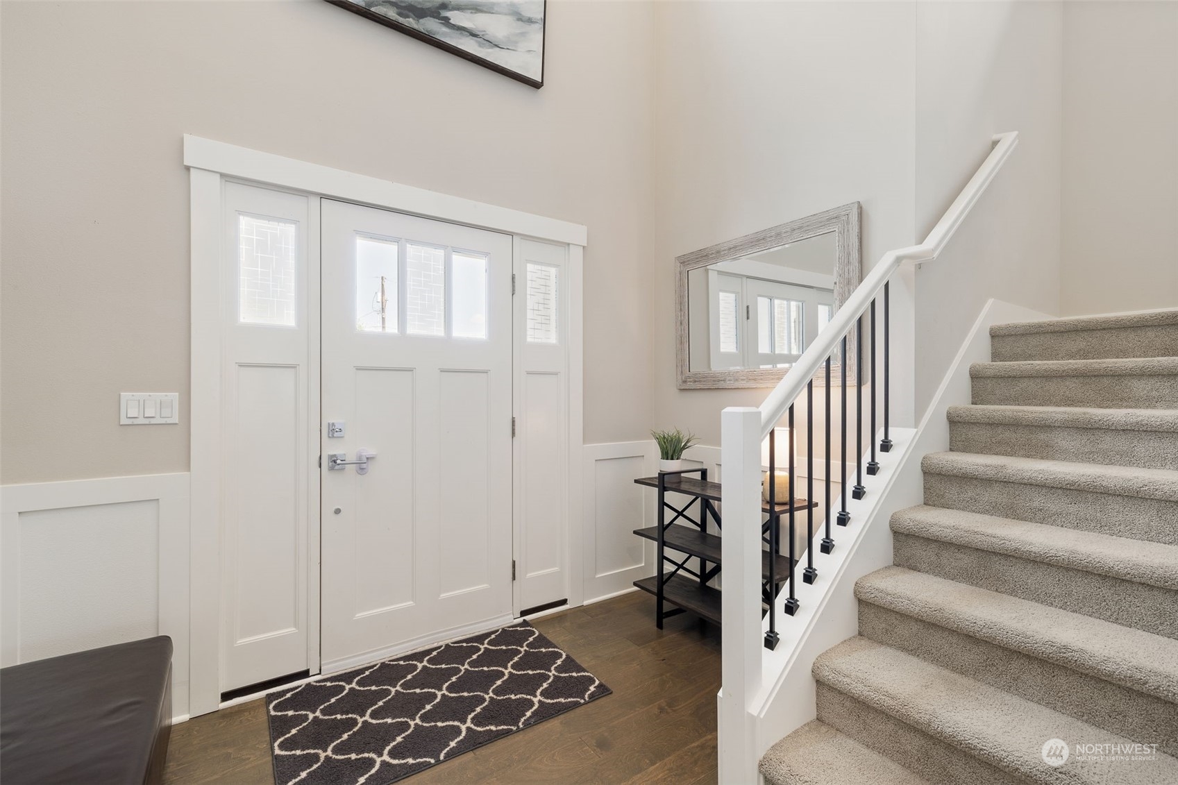 18 213th Street Southwest Bothell, WA 98021 - Photo 6 of 40 a view of entryway with wooden floor and stairs