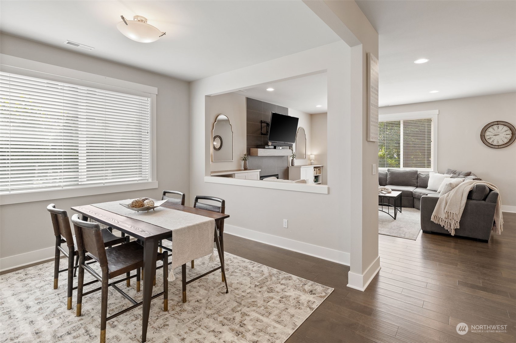 18 213th Street Southwest Bothell, WA 98021 - Photo 7 of 40 a view of a dining room with furniture and wooden floor