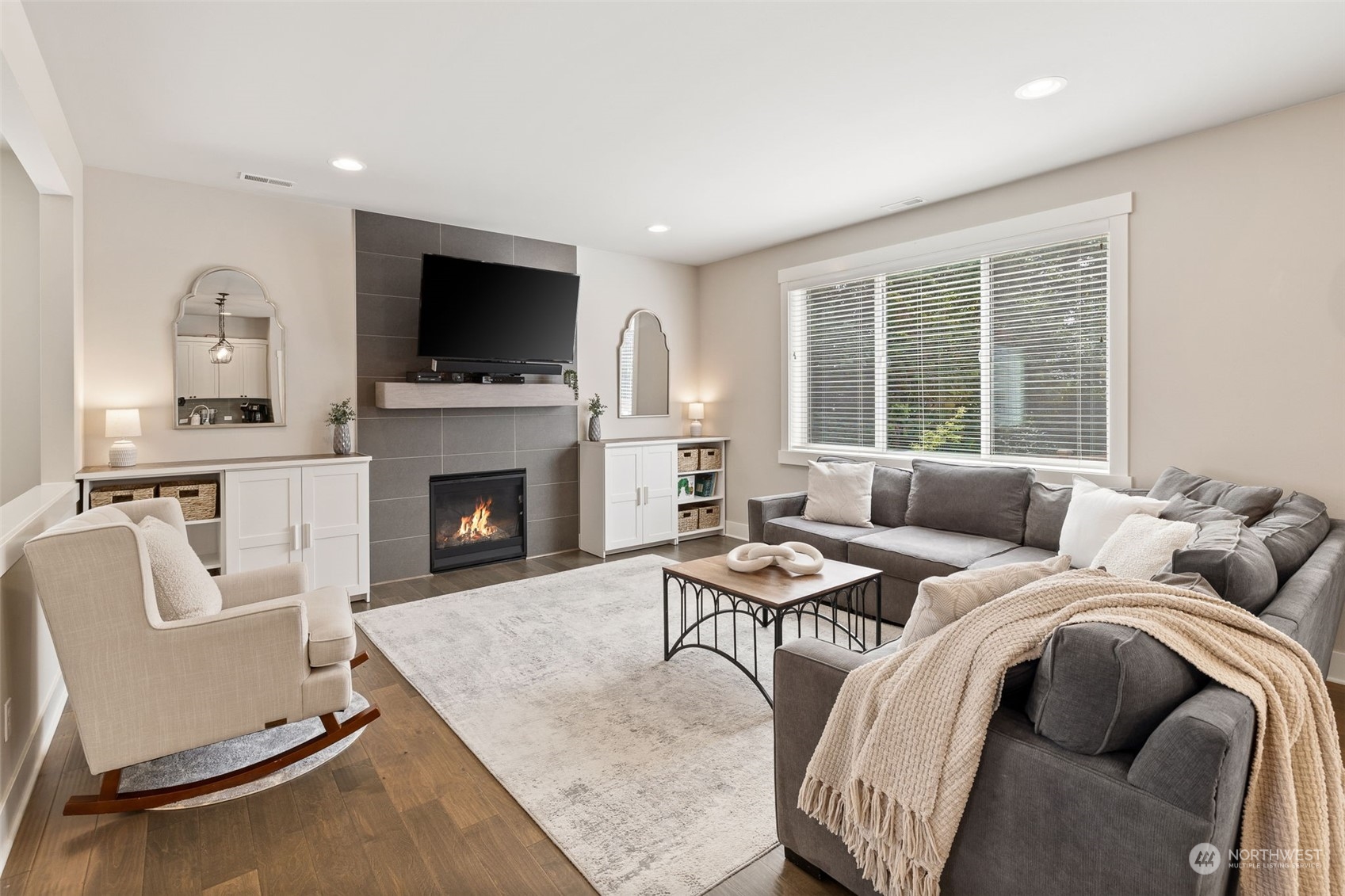 18 213th Street Southwest Bothell, WA 98021 - Photo 8 of 40 a living room with furniture fireplace and a flat screen tv