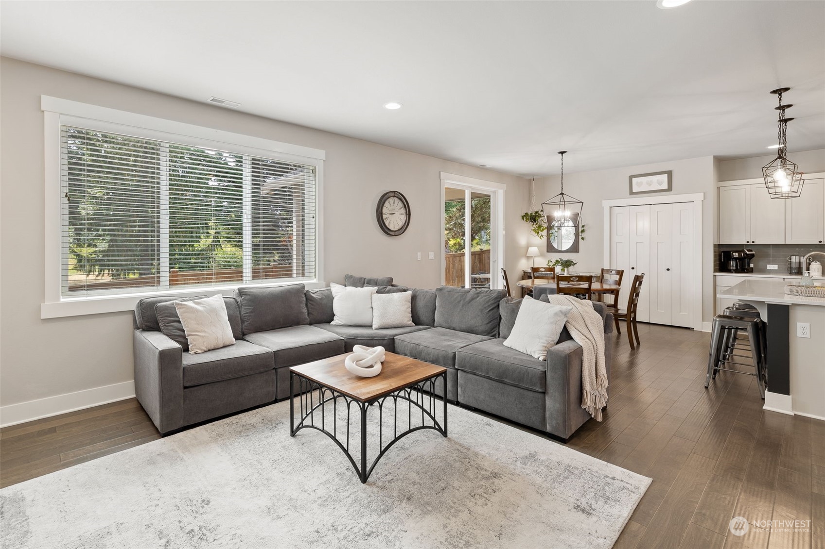 18 213th Street Southwest Bothell, WA 98021 - Photo 10 of 40 a living room with furniture and wooden floor