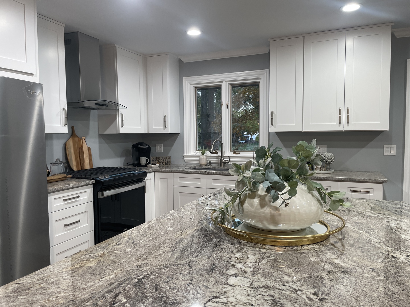 5N430 Oak Road St. Charles, IL 60175 - Photo 11 of 36 a kitchen with kitchen island granite countertop a sink a stove and a refrigerator