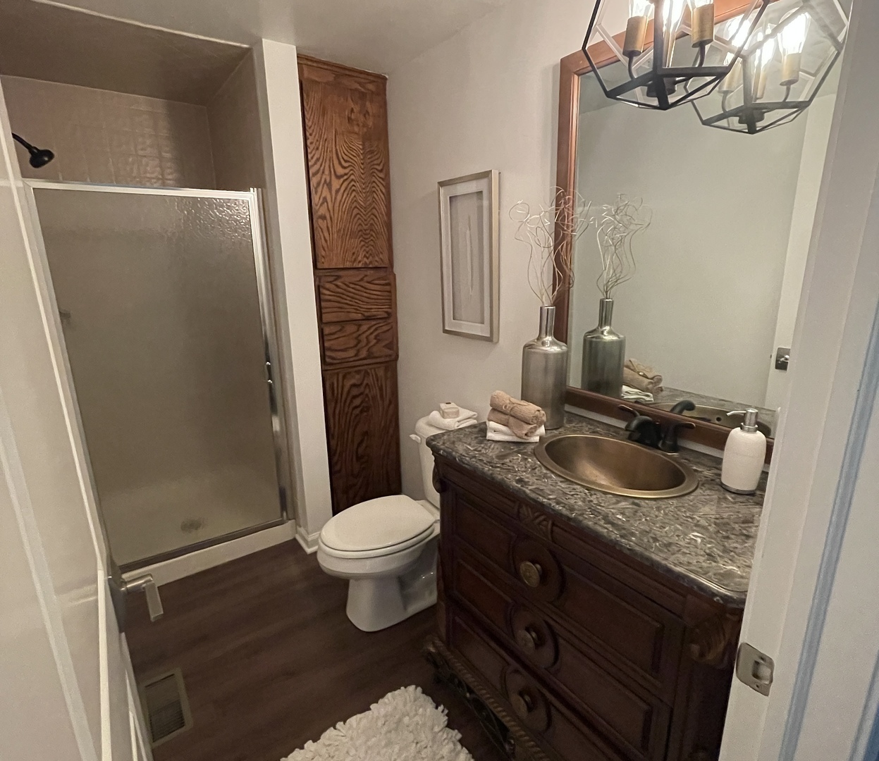 5N430 Oak Road St. Charles, IL 60175 - Photo 27 of 36 a bathroom with a granite countertop sink toilet and shower