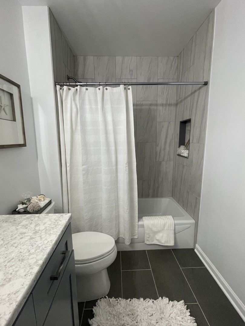 5N430 Oak Road St. Charles, IL 60175 - Photo 29 of 36 a bathroom with a granite countertop sink toilet and shower