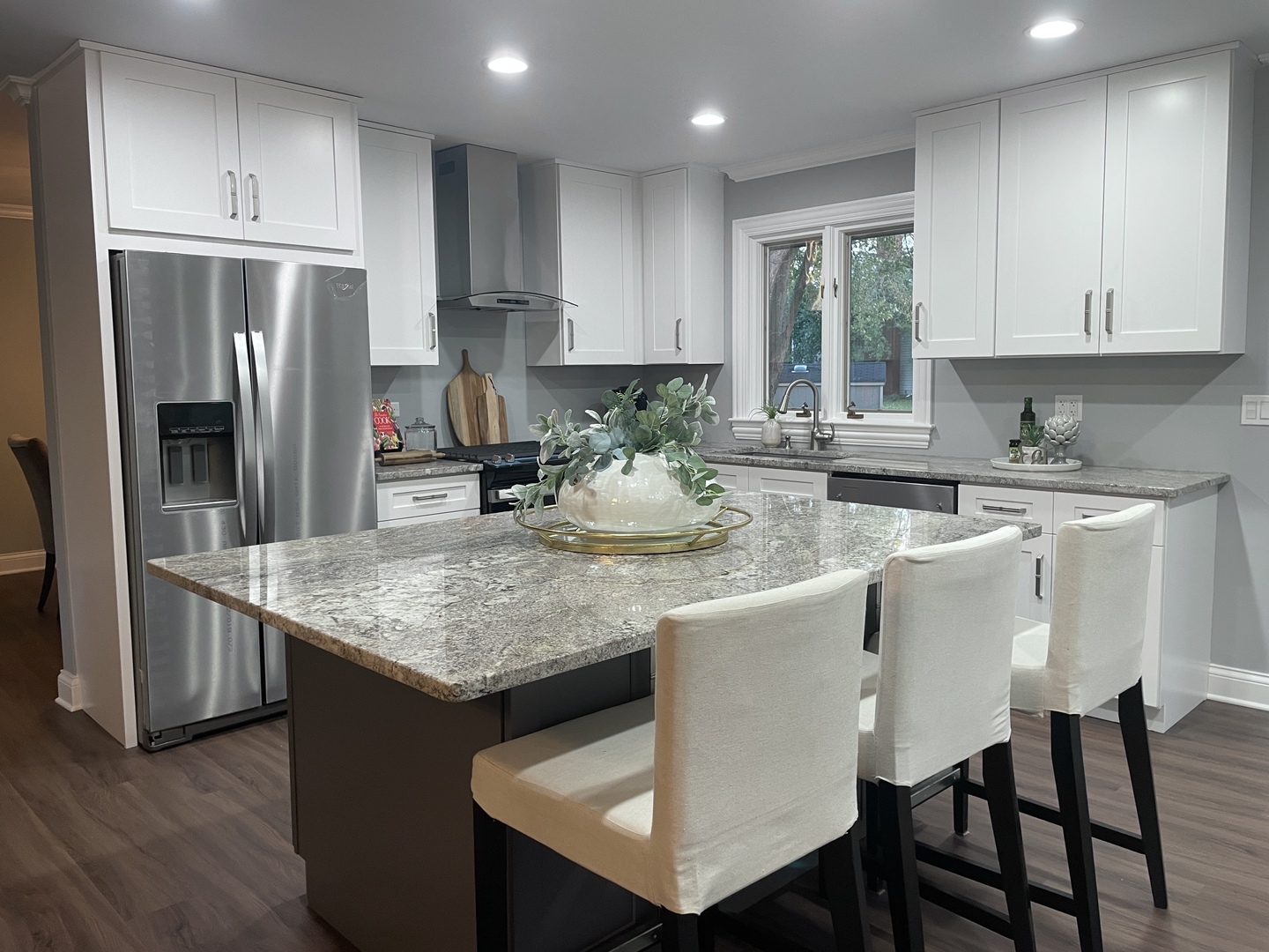 5N430 Oak Road St. Charles, IL 60175 - Photo 9 of 36 a kitchen with stainless steel appliances granite countertop a table chairs refrigerator and sink