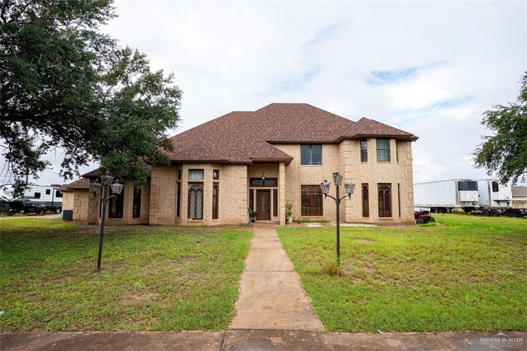 809 North Trosper Road Alton, TX 78573 - Photo 1 of 1 View of front of house with a front lawn