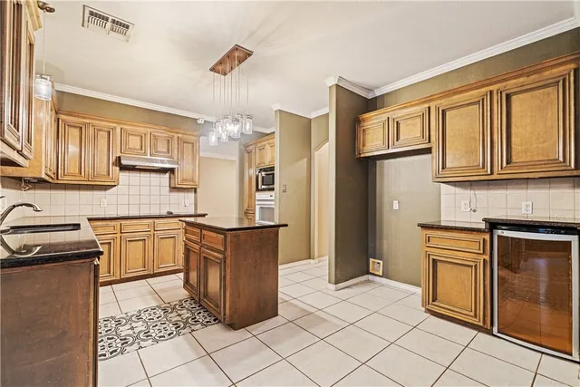 a kitchen with stainless steel appliances granite countertop a sink and dishwasher a stove with wooden floor
