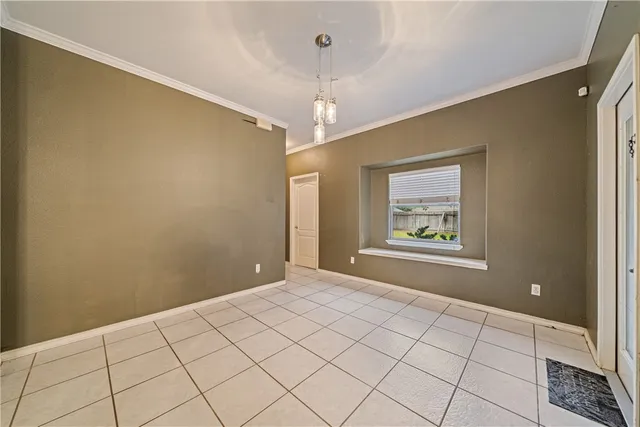 a view of a kitchen with kitchen island granite countertop a refrigerator and a stove top oven