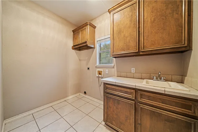an empty room with windows and ceiling fan